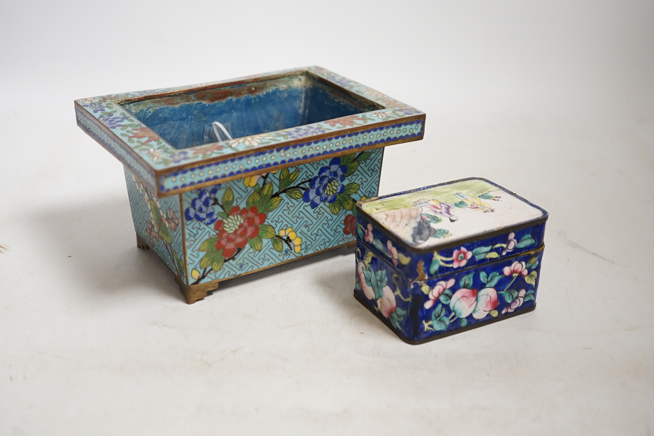 A Chinese cloisonné enamel floral jardiniere and a Canton enamel box and cover depicting two figures before a landscape, largest 16cm wide. Condition - poor to fair